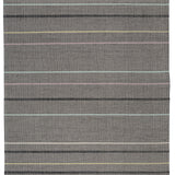 Full size Jasper Waffle Rug in Jet, widely spaced thin stripes of yellow, pink, black, acqua and white on a grey field. 
