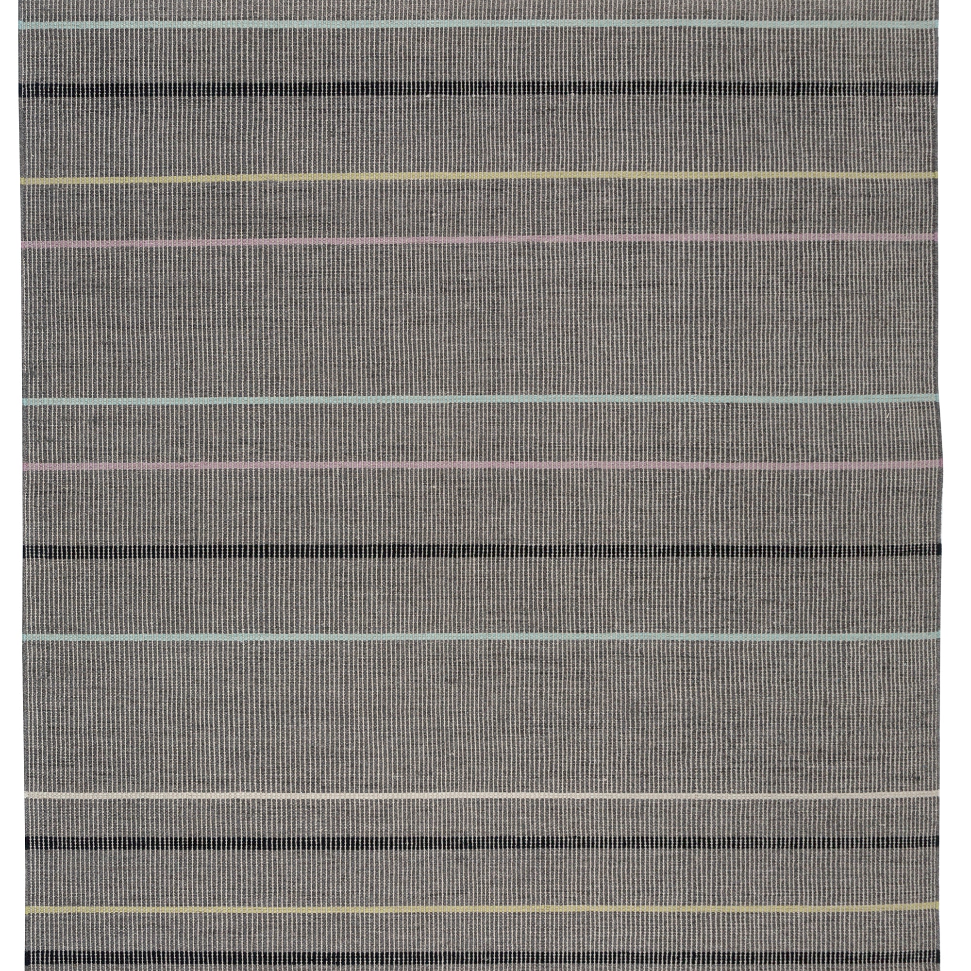 Full size Jasper Waffle Rug in Jet, widely spaced thin stripes of yellow, pink, black, acqua and white on a grey field. 