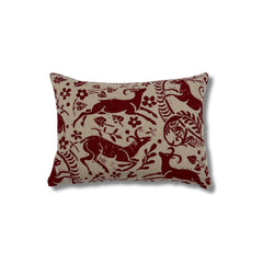 Rectangular throw pillow with a red ram and botanical printed pattern on a natural linen background. 