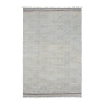 A fringed wool rug in a large-scale dash print in gray on a light-gray mottled surface.