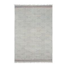 Dash Rug by Oliver Yaphe has a lattice pattern in pale blue with a white, navy and purple striped border with tassels