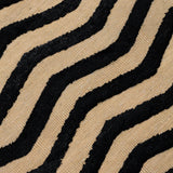 Deatil of the Penta Chevron Rug in Onyx-Ivory a black and white chevron pattern. 