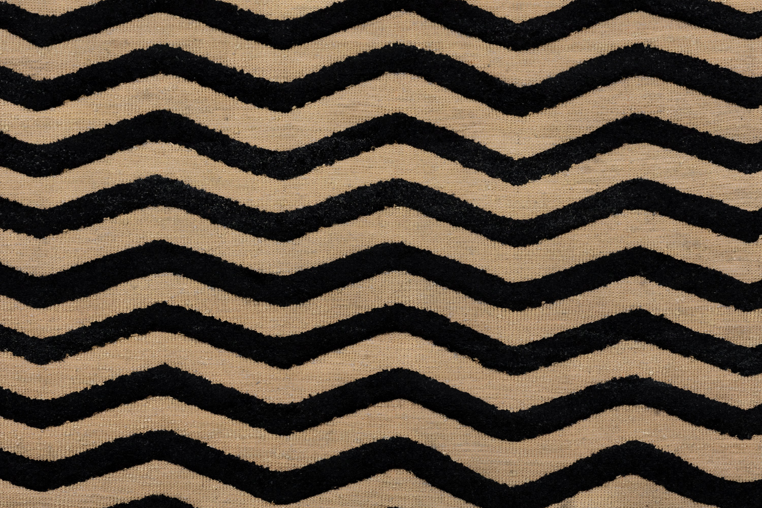 Deatil of the Penta Chevron Rug in Onyx-Ivory a black and white chevron pattern. 