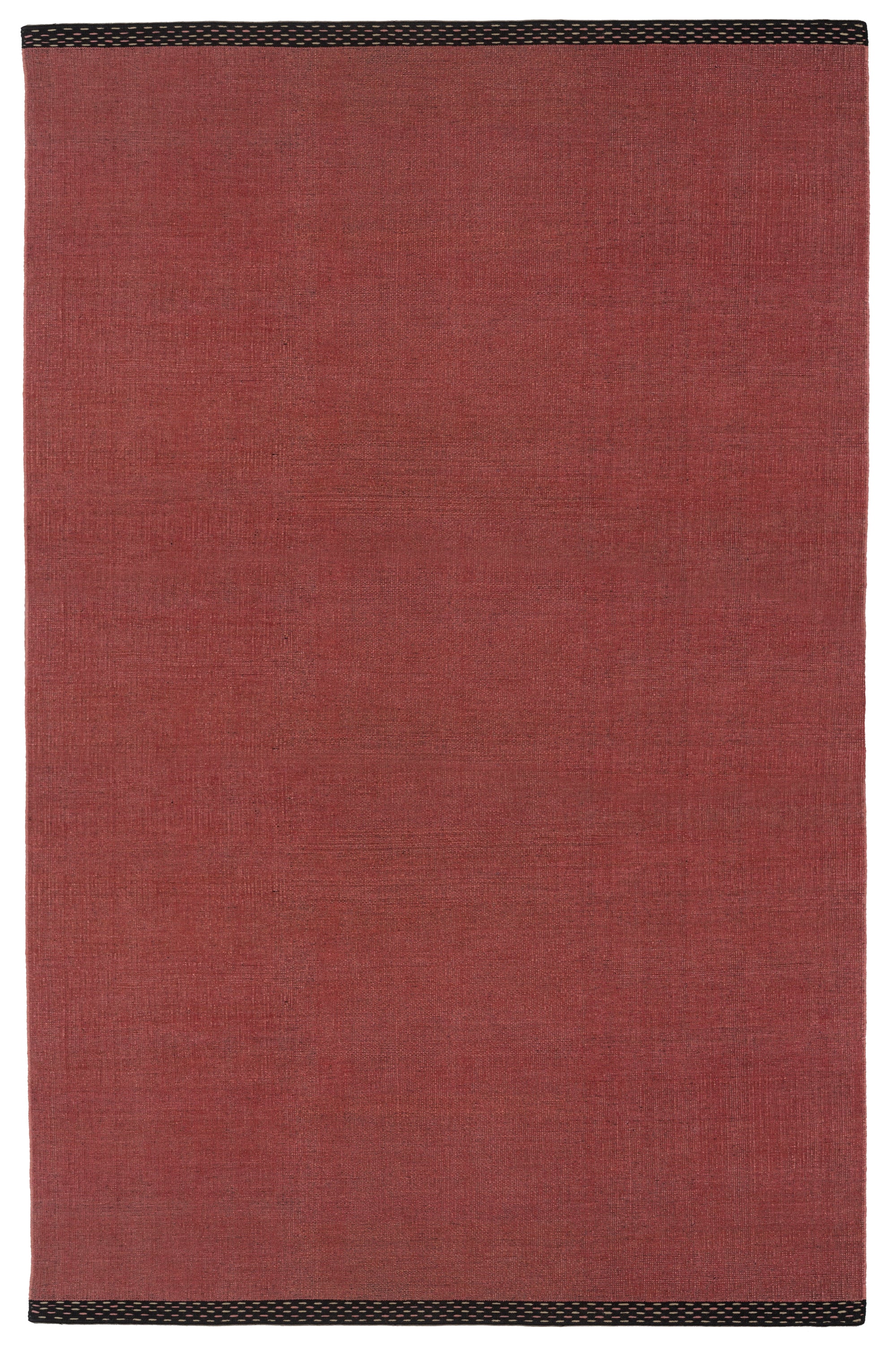 Full Size Plain Stitched Border Rug in Carmine, a solid red rug with a black border with black border with pink and taupe dashes. 