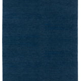 Full Size Plain Stitched Border Rug in Prussian Blue, a solid indigo rug with a black border with black border with blue and taupe dashes. 