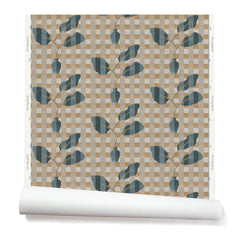 Wallpaper roll with a complex chambray and petrol blue floral motif overlayed a white and tan plaid pattern. 