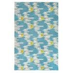 Rectangular woven rug in an undulating stripe pattern in cream with yellow accents, on a bright blue field.