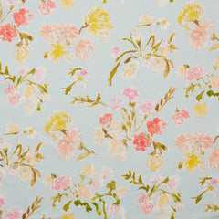 Linen swatch with a pattern of large-scale line-drawn flowers in gray ink with red, pink and yellow watercolors, on a light blue background.