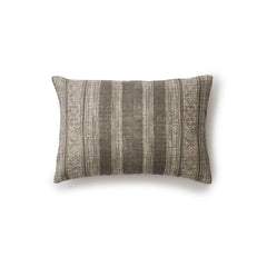 Rectangular throw pillow in a striped pattern of intricate white lines over a washed charcoal background.