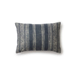 Rectangular throw pillow in a striped pattern of intricate white lines over a washed navy background.