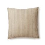 Square throw pillow in a striped pattern of intricate white lines over a washed beige background.