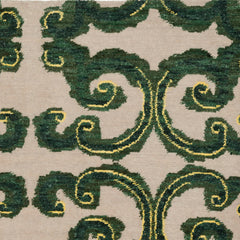 Amped Up rug swatch with a large curlie cue design in shades of  green and bright yellow on an ivory field.