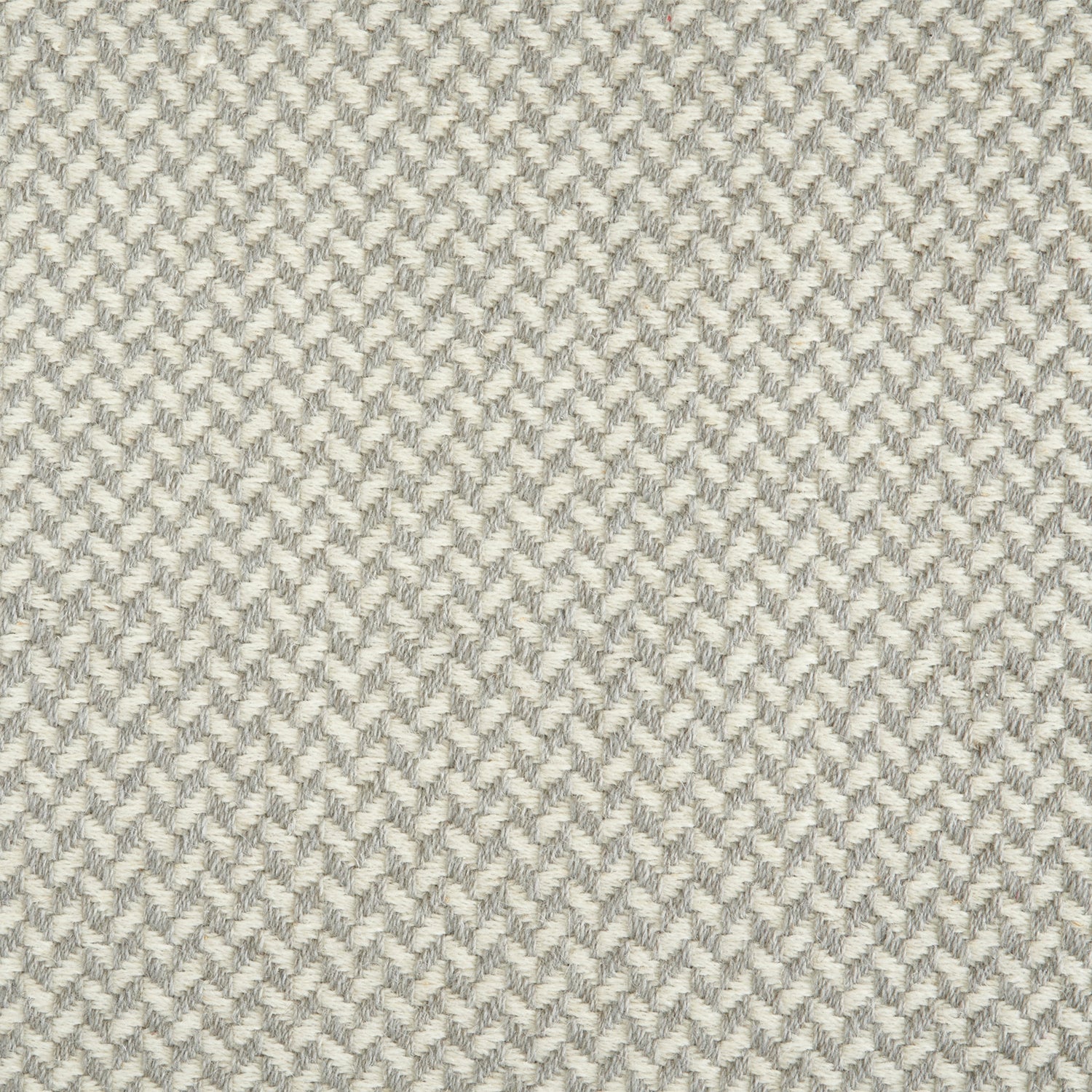 Wool broadloom carpet swatch in a herringbone pattern in shades of alternating cream and gray.
