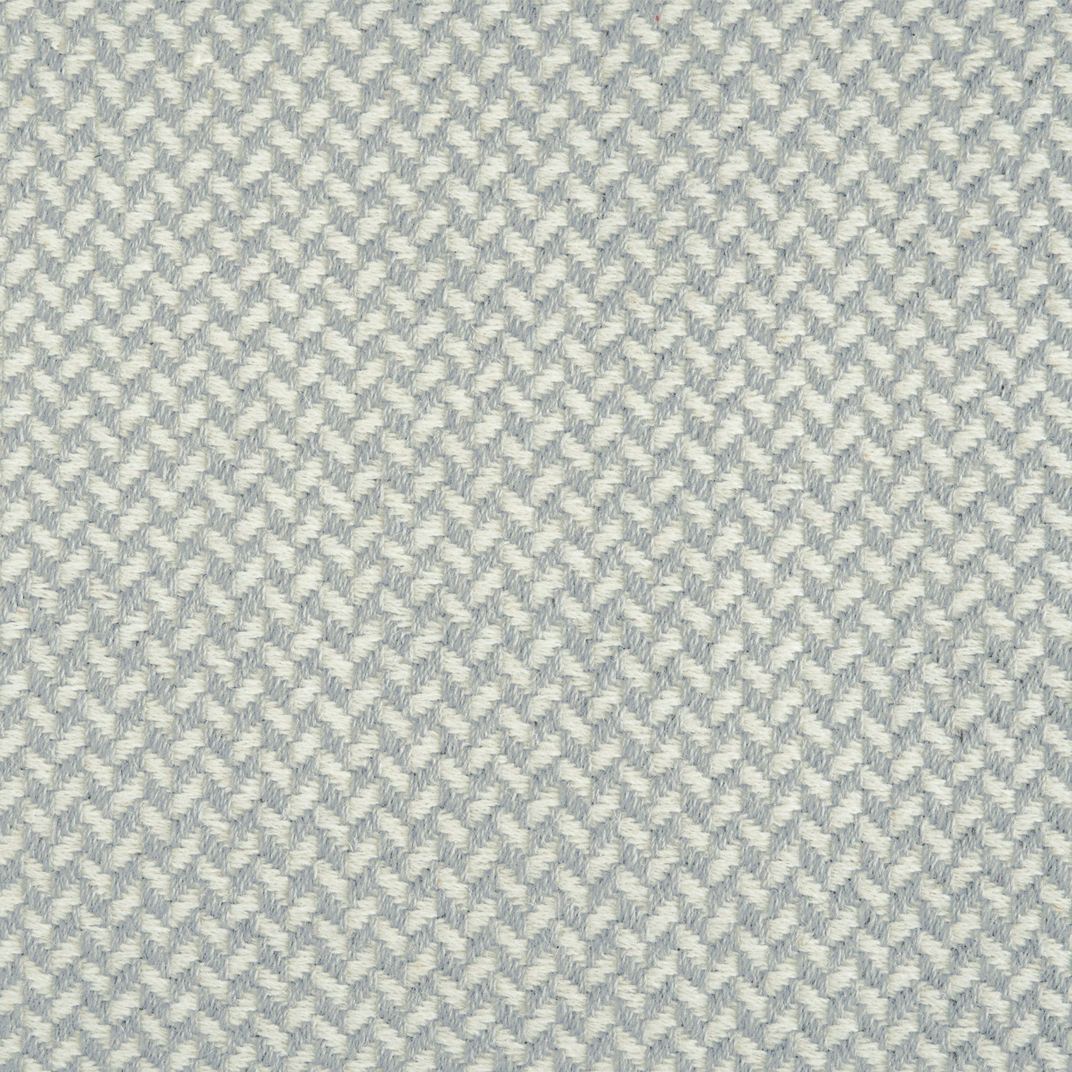 Wool broadloom carpet swatch in a herringbone pattern in shades of alternating cream and light gray.