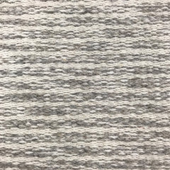 Wool broadloom carpet swatch in a large-scale weave texture in a mottled cream and gray colorway.