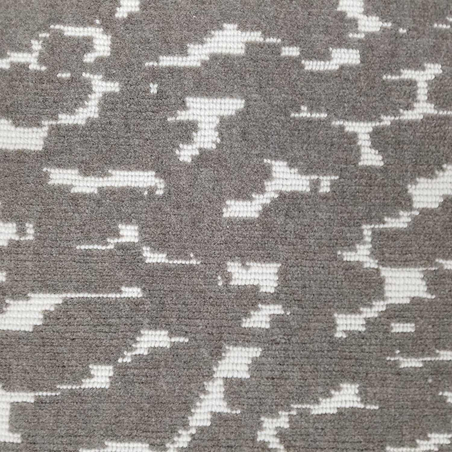 Wool broadloom carpet swatch in a woven cloud pattern in gray with cream accents.