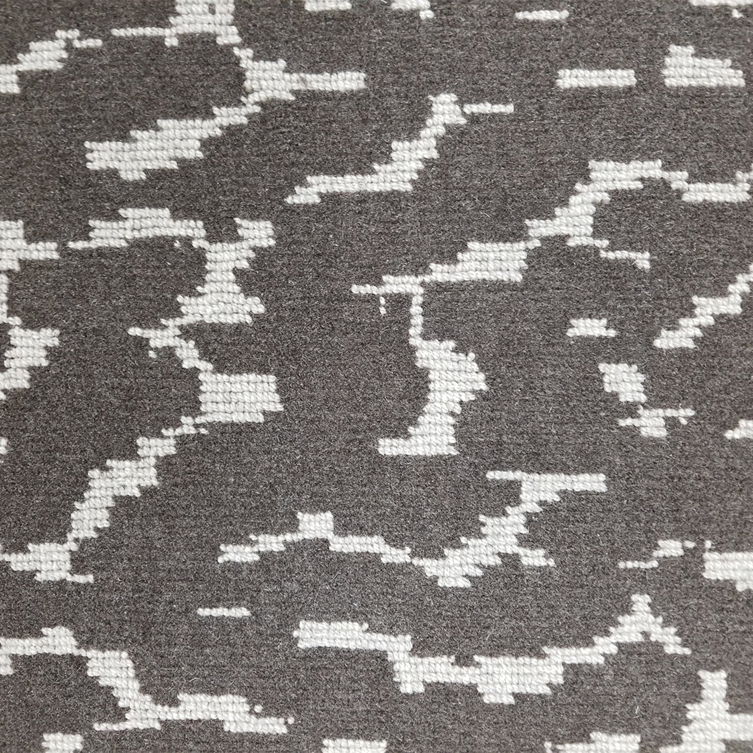 Wool broadloom carpet swatch in a woven cloud pattern in dark gray with light gray accents.