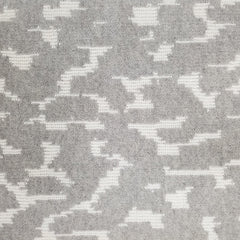 Wool broadloom carpet swatch in a woven cloud pattern in light gray with cream accents.