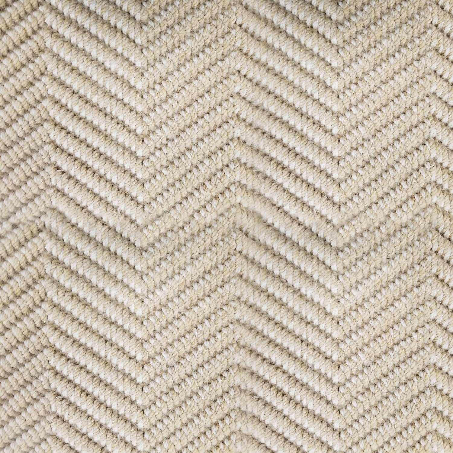 Wool broadloom carpet swatch in a dimensional chevron weave in a light gold colorway.