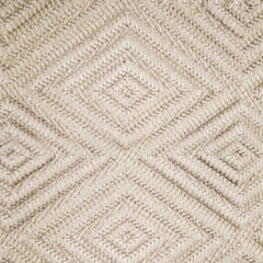 Wool broadloom carpet swatch woven in a dimensional diamond print in light tan.