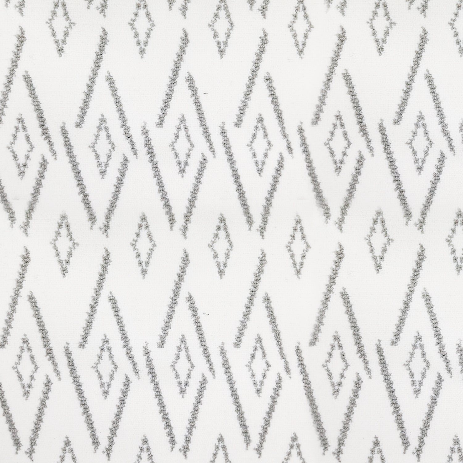 Woven broadloom carpet swatch in a repeating irregular diamond pattern in light gray on a white field.