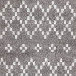 Wool broadloom carpet swatch in a repeating diamond print in light gray on a brown field.
