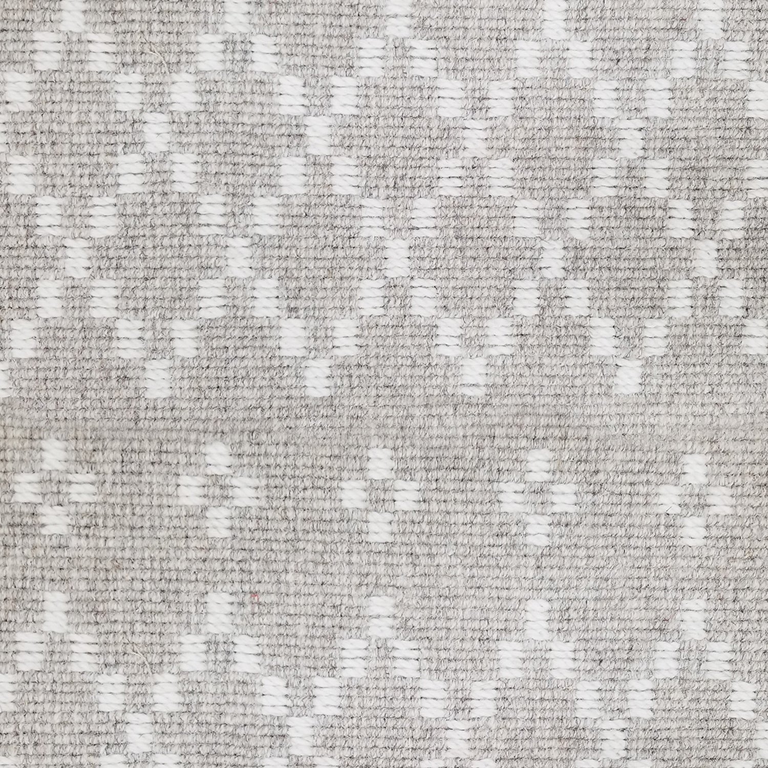 Wool broadloom carpet swatch in a repeating diamond print in cream on a silver field.