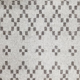 Wool broadloom carpet swatch in a repeating diamond print in dark gray on a silver field.