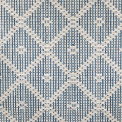Wool broadloom carpet swatch in a repeating diamond check pattern in blue and cream.