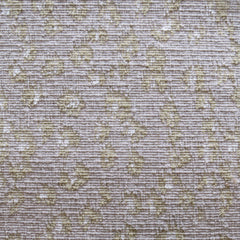 Wool broadloom carpet swatch in a painterly floral pattern in beige and cream on a mauve field.