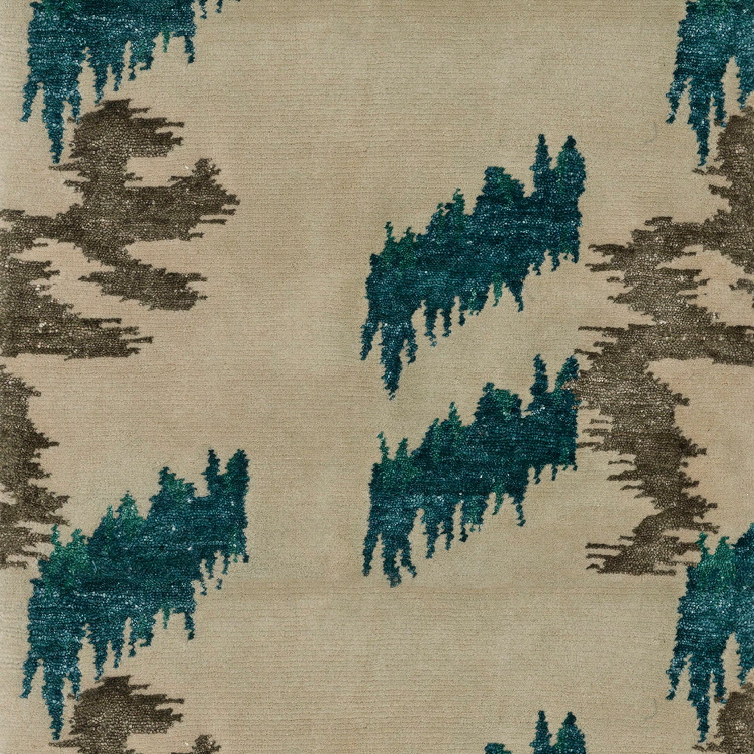 Detail of Stepping Stones rug featuring an organic jagged linear design in silver and teal on an ivory ground