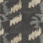 Detail of Stepping Stones rug featuring an organic jagged linear design in silver and white on a grey ground