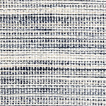 Wool-polyester broadloom carpet swatch in a multicolor navy and white weave.