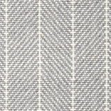 Wool broadloom carpet swatch in a herringbone stripe in gray and white.