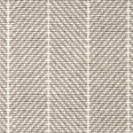 Wool broadloom carpet swatch in a herringbone stripe in tan and cream.