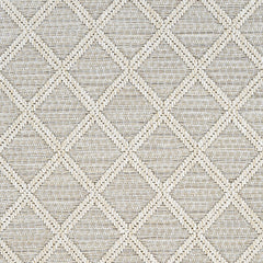 Outdoor broadloom carpet swatch in a geometric diamond weave in beige and tan.
