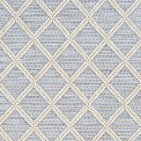 Outdoor broadloom carpet swatch in a geometric diamond weave in beige and light blue.