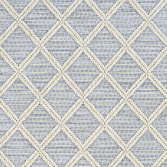 Outdoor broadloom carpet swatch in a geometric diamond weave in beige and light blue.