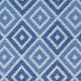 Wool broadloom carpet swatch in a geometric diamond weave in multicolor blue and white.