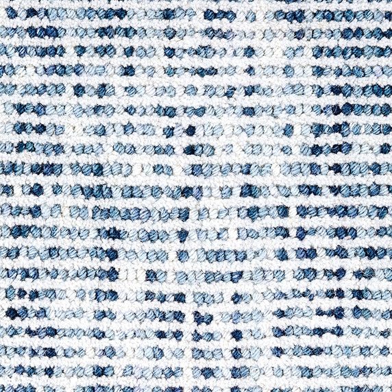 Wool broadloom carpet swatch in a looped stripe weave in white and shades of blue.