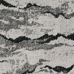 Wool-nylon broadloom carpet swatch in a painterly cloud pattern in shades of gray and charcoal.