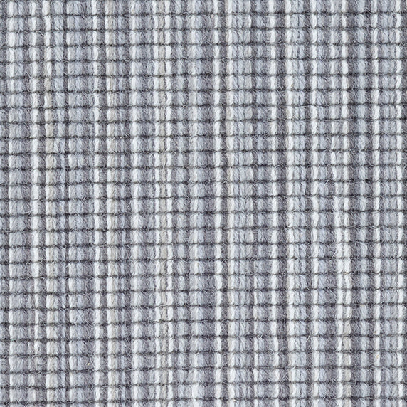 Wool broadloom carpet swatch in a multicolor stripe in shades of white, gray and blue.