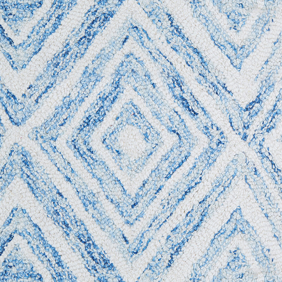 Wool broadloom carpet swatch in a painterly diamond pattern in blue and white.