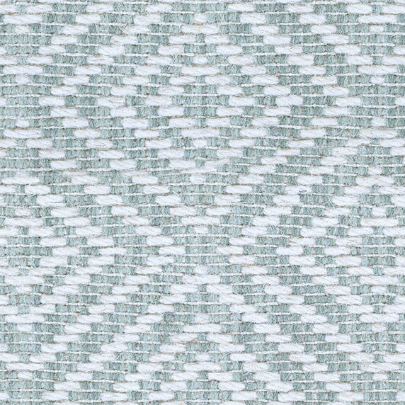 Wool broadloom carpet swatch in a woven geometric diamond print in teal and cream.