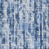High-pile wool broadloom carpet swatch in a mottled blue colorway.