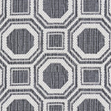 Wool broadloom carpet swatch in a repeating geometric grid weave in white and charcoal.