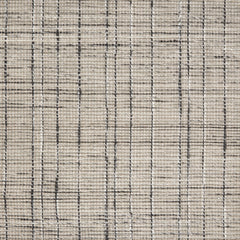 Wool-nylon broadloom carpet swatch in a textured plaid weave in tan and charcoal.