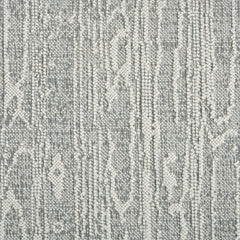 Wool-blend broadloom carpet swatch in a dimensional treetrunk weave pattern in cream and gray.