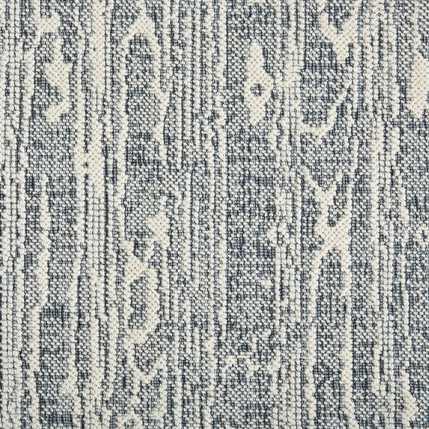 Wool-blend broadloom carpet swatch in a dimensional treetrunk weave pattern in cream and charcoal.