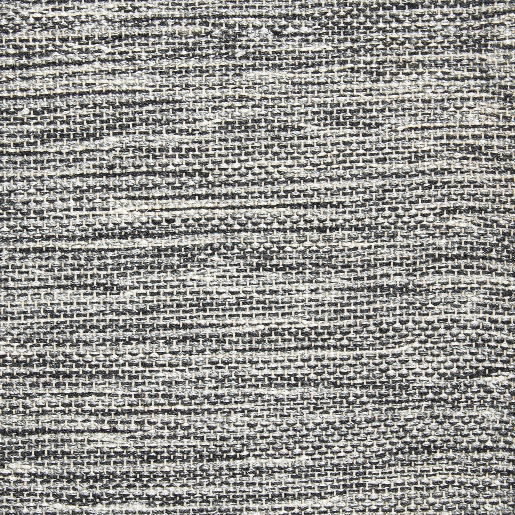 Wool-blend broadloom carpet swatch in a chunky weave texture in mottled charcoal and white.